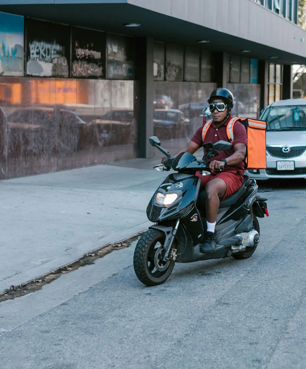Dispatch rider delivering on a motor scooter