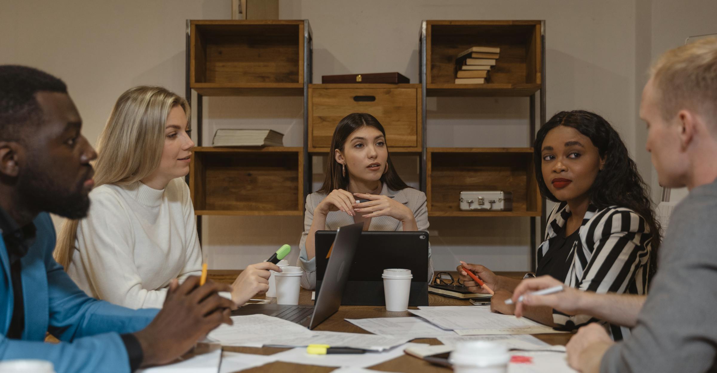 Leadership team reviewing strategy documents in a meeting
